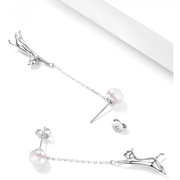Boucles d'oreilles pendantes avec perles
